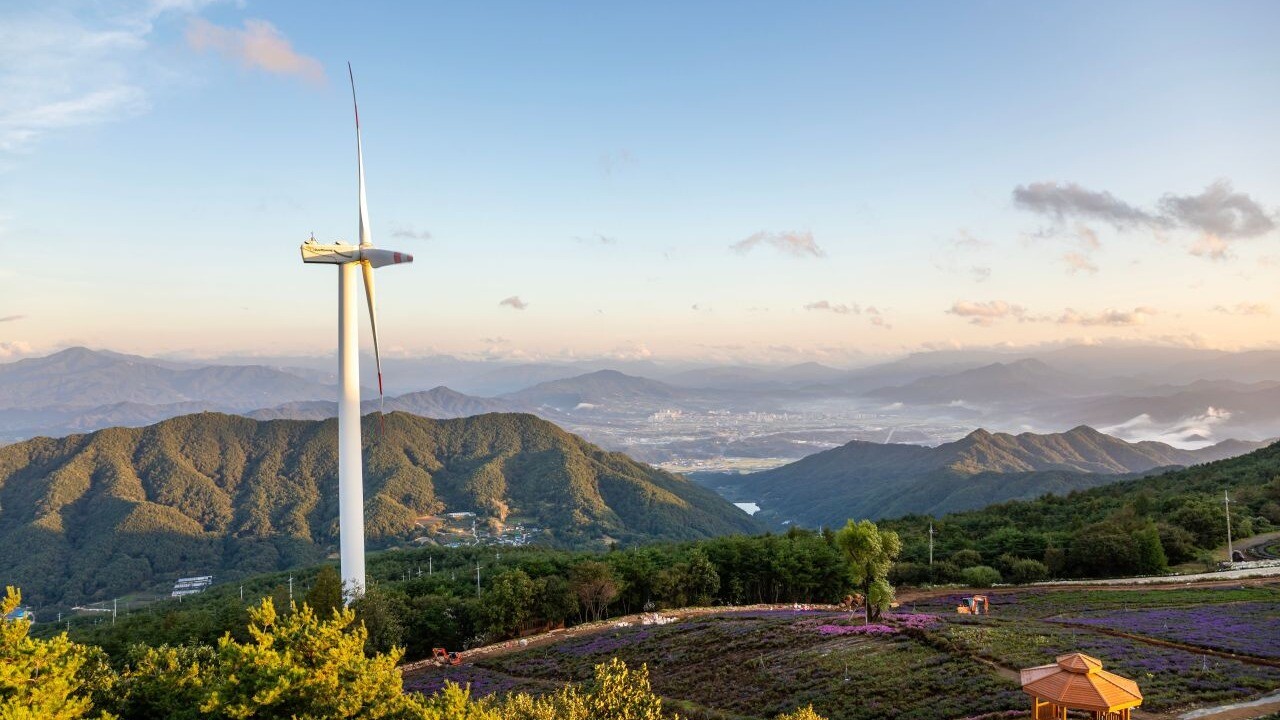 Wind turbine and distant mountain ridges seen from Byeolbaram Hill