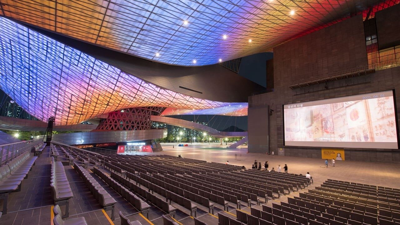 Outdoor seating and a screen at Busan Cinema Center